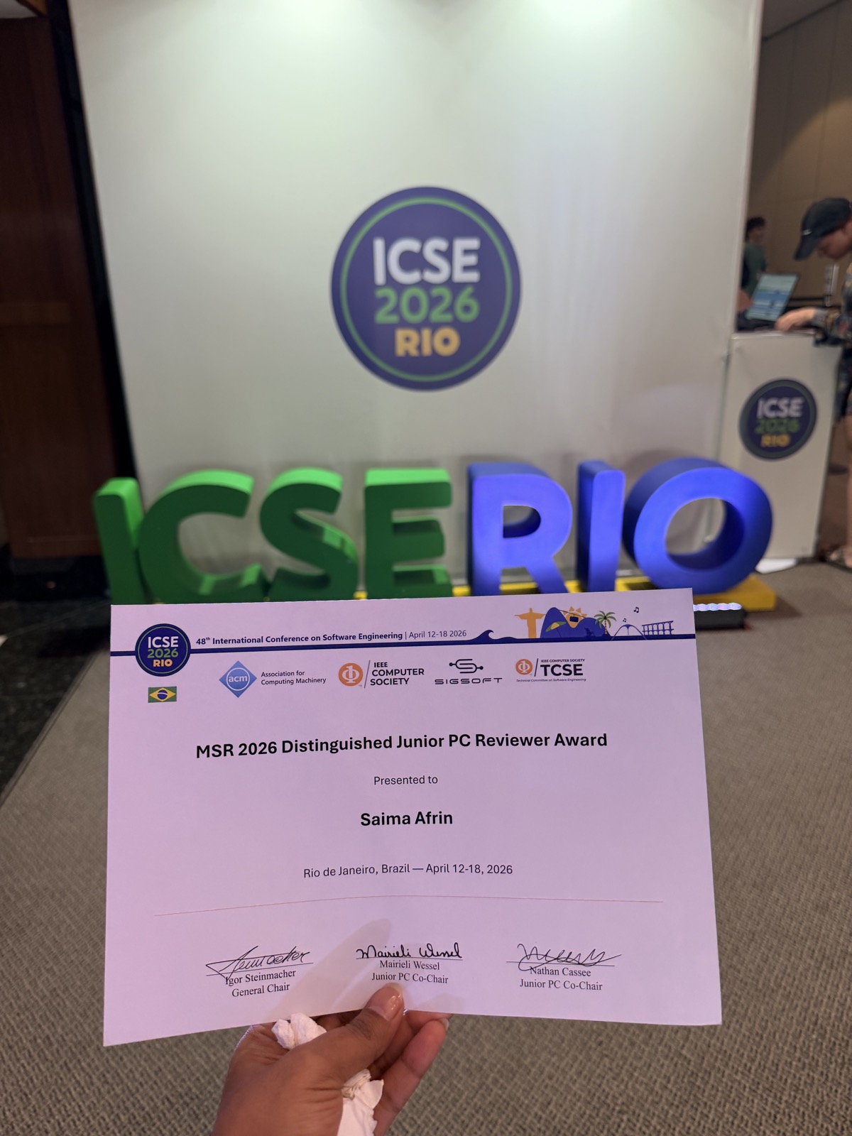 Receiving the MSR 2026 Distinguished Junior PC Reviewer Award at ICSE 2026, Rio de Janeiro